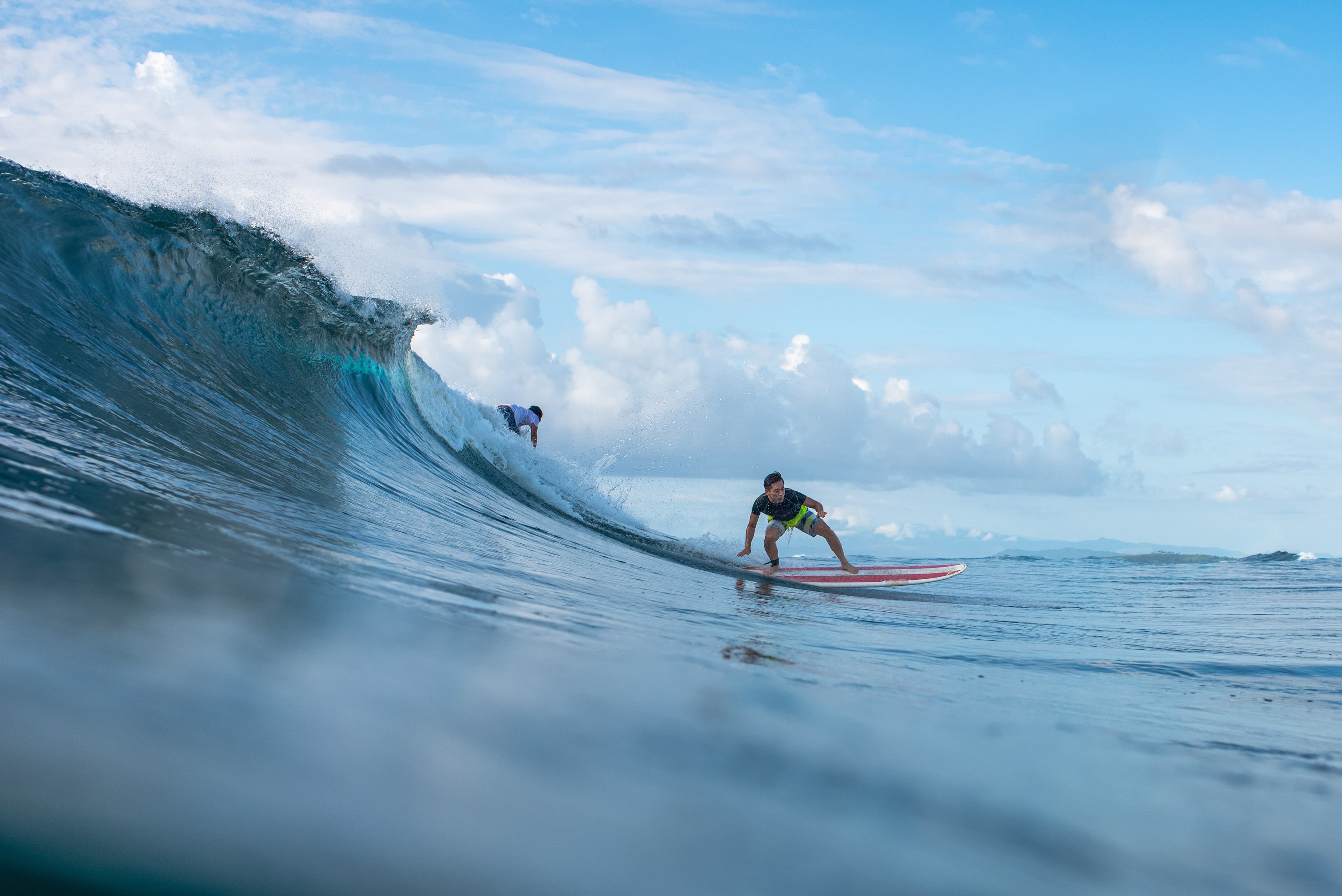 Beginner surfer takes off on a wave at Pansukyan captured by Mati Olivieri