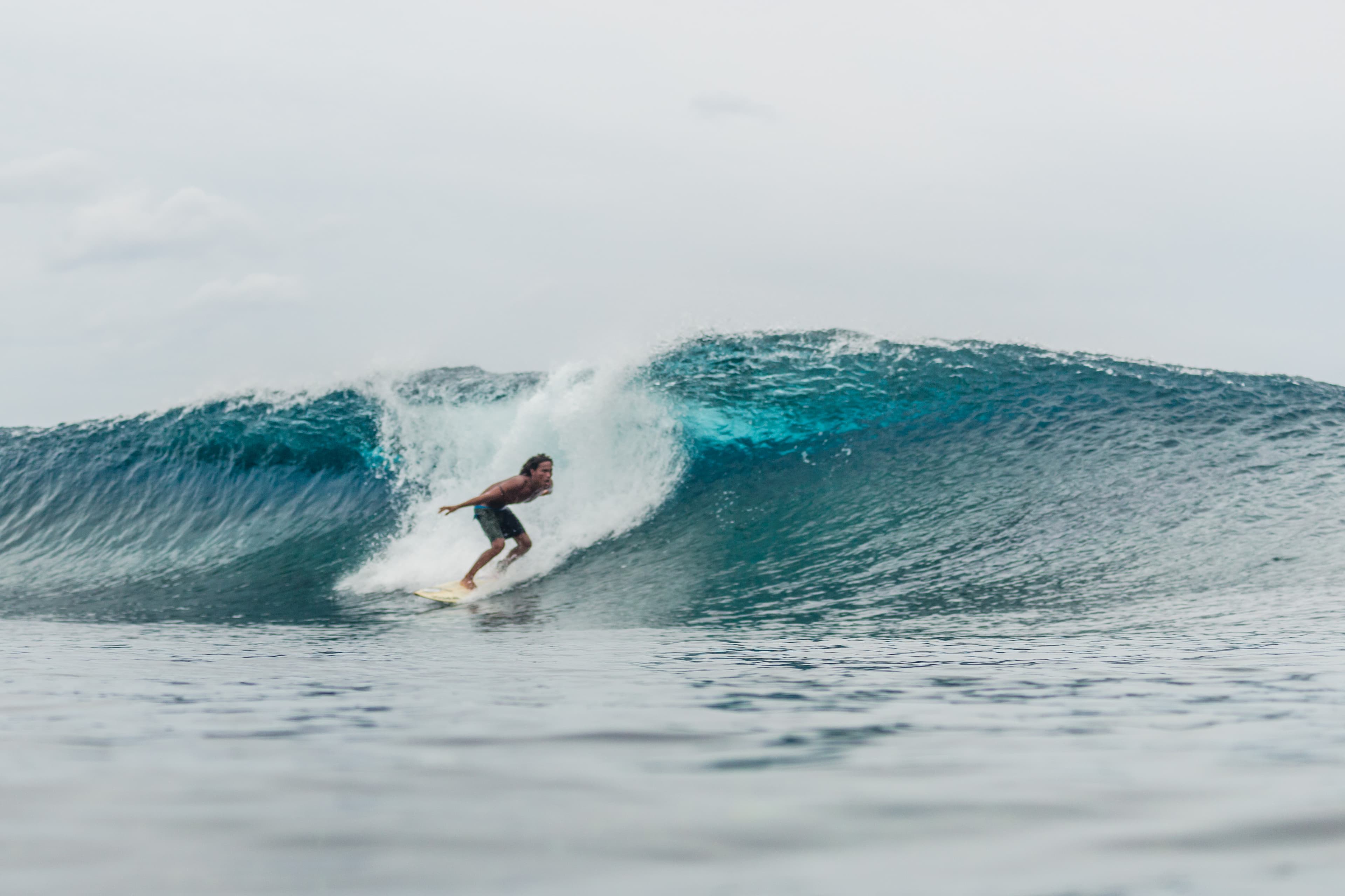 Surfer getting barelled at Tuason in Siargao, Philippines.